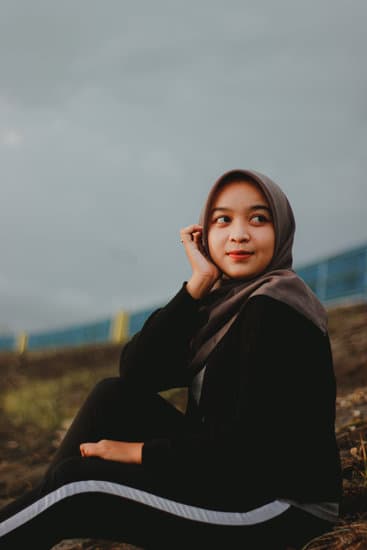 A Girl with a Hijab Posing with Her Hand on Her Cheek - Photos by Canva