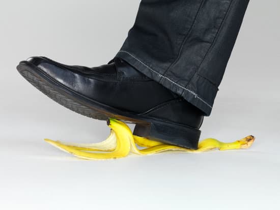 Business risk concept - Man stepping on banana peel - Photos by Canva
