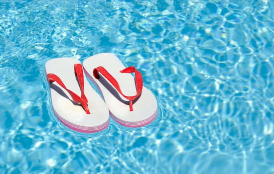 Sandals Floating on a Swimming Pool - Photos by Canva