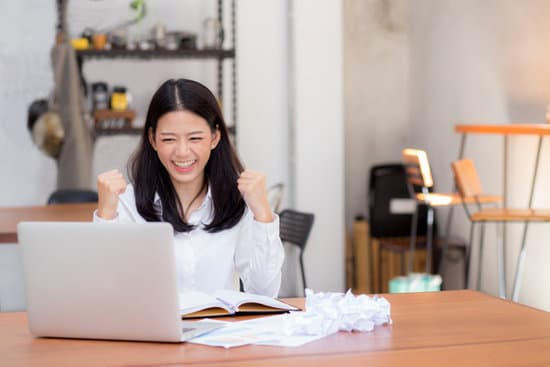 Happy Woman Working Online on Laptop 