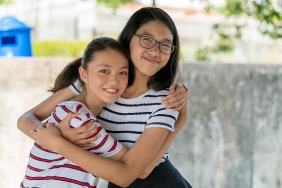 Two Hugging Teenage Girls Photos By Canva 