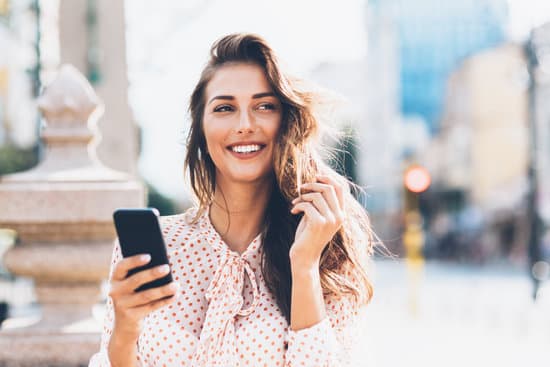 Happy woman using smart phone