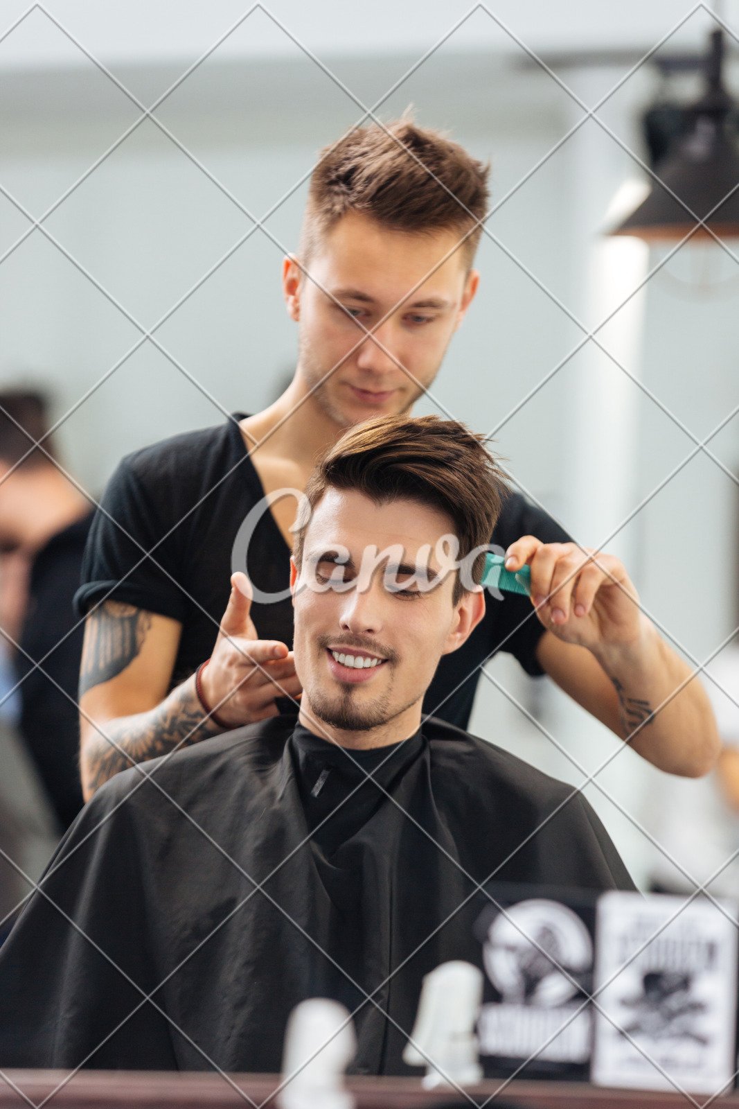 Young Man Getting Haircut By Hairdresser At Barbershop Photos By