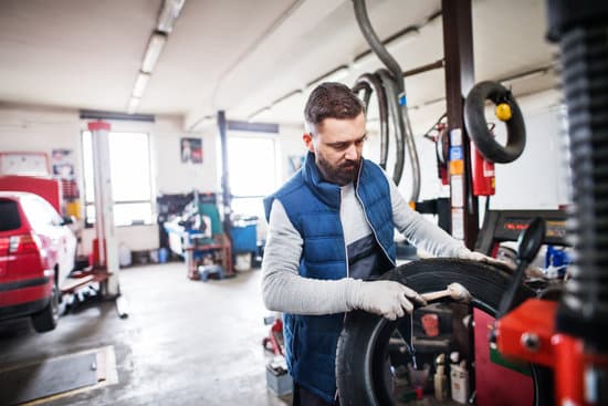 Repair Man In Garage Photos By Canva