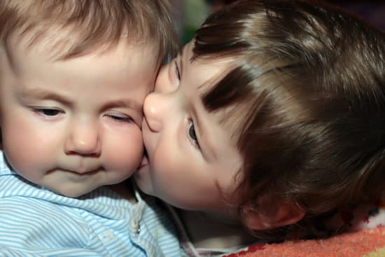 Two Siblings Kissing Photos By Canva