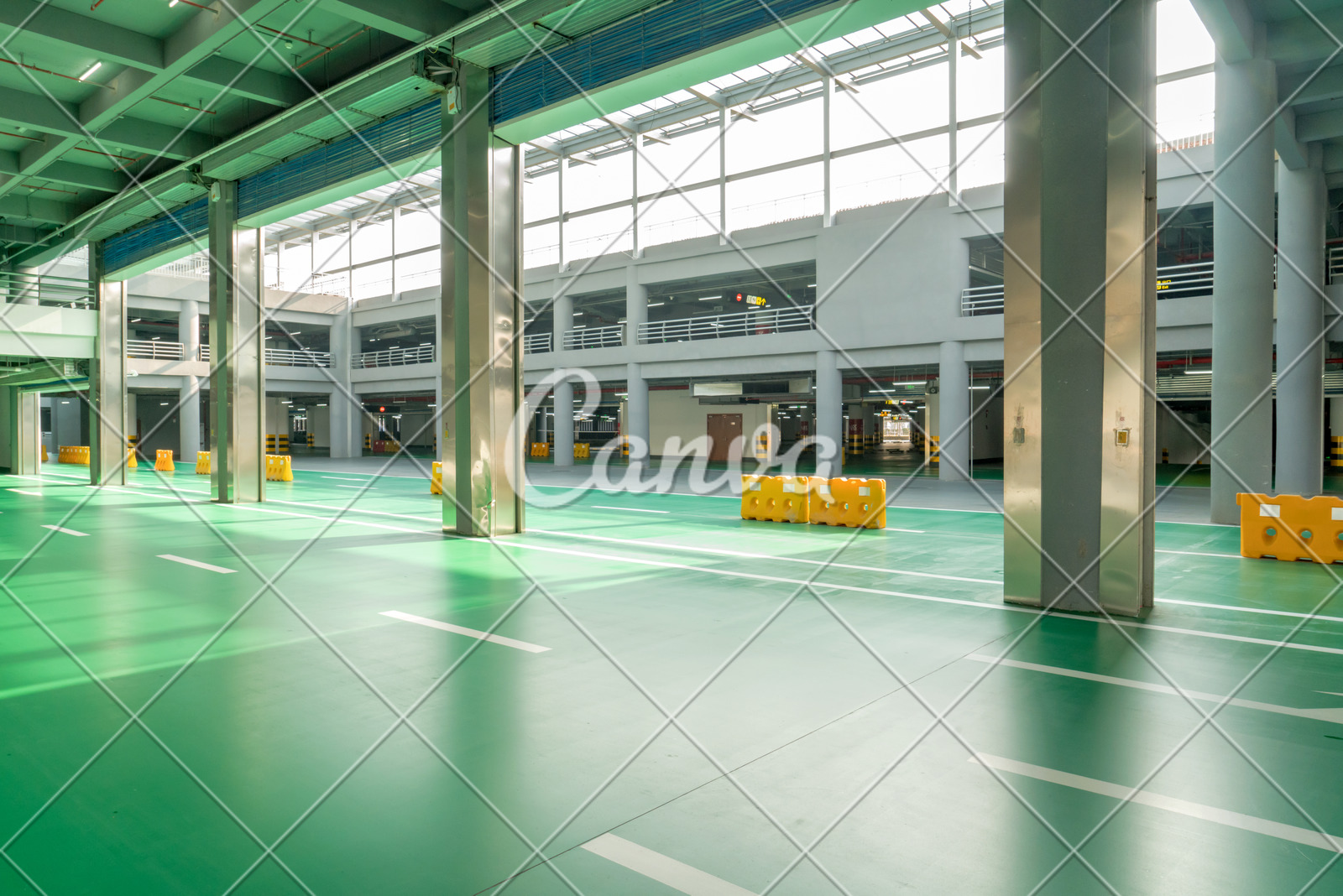 Interior Of Parking Garage With Car And Vacant Parking Lot In