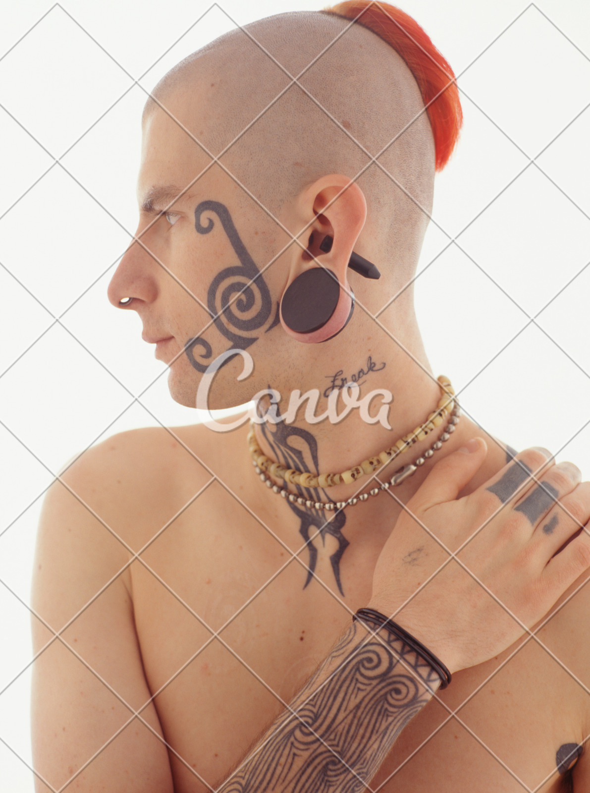 Tattooed Young Man Wearing Earplugs And Conch Piercing Red