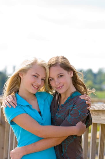 Teenage Girls Hugging Photos By Canva 