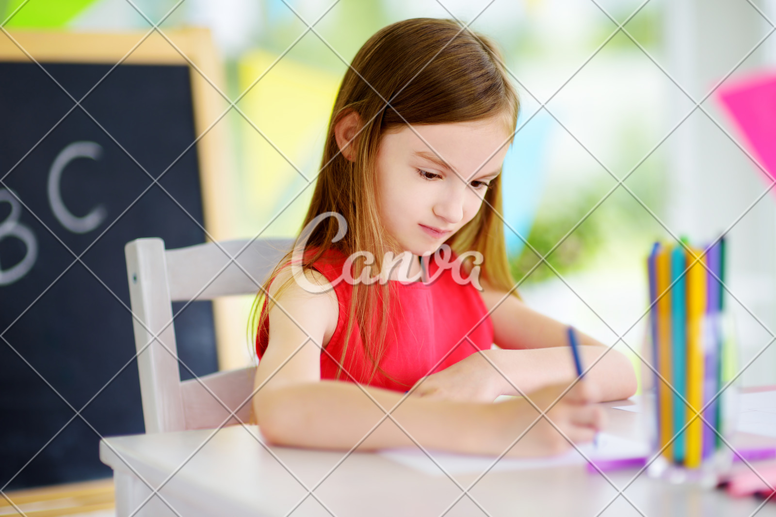 Cute Little Girl Drawing With Colorful Pencils At A Daycare