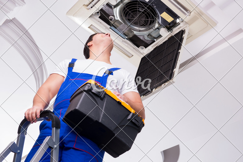 Worker Repairing Ceiling Air Conditioning Unit Photos By Canva