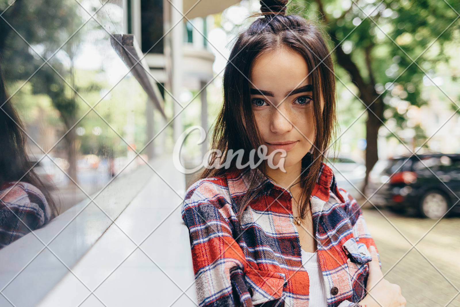 Teen Girl With Long Dark Hair And Half Up Bun Hairstyle