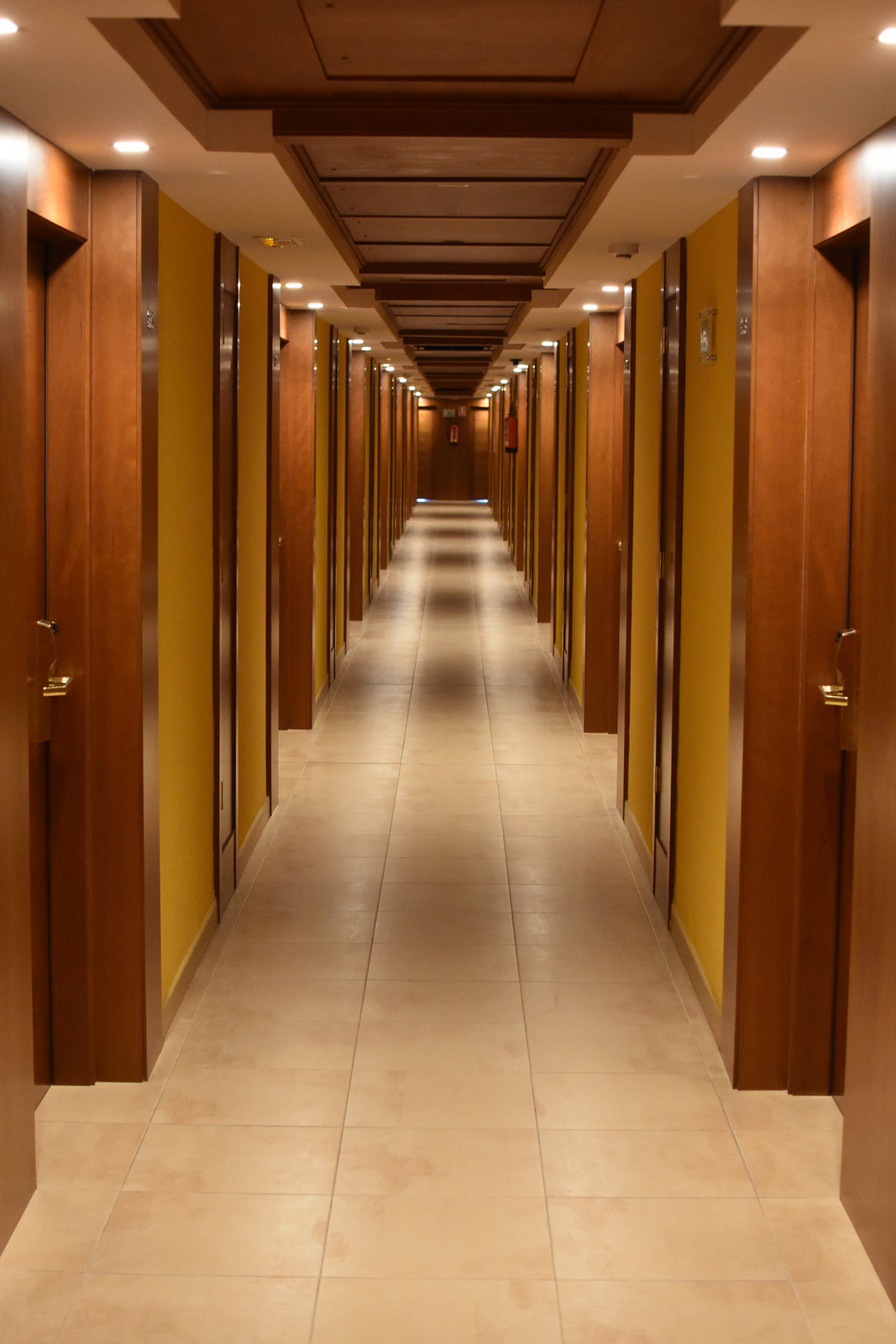 Turned On Lights Along Hotel Hallway Photos By Canva