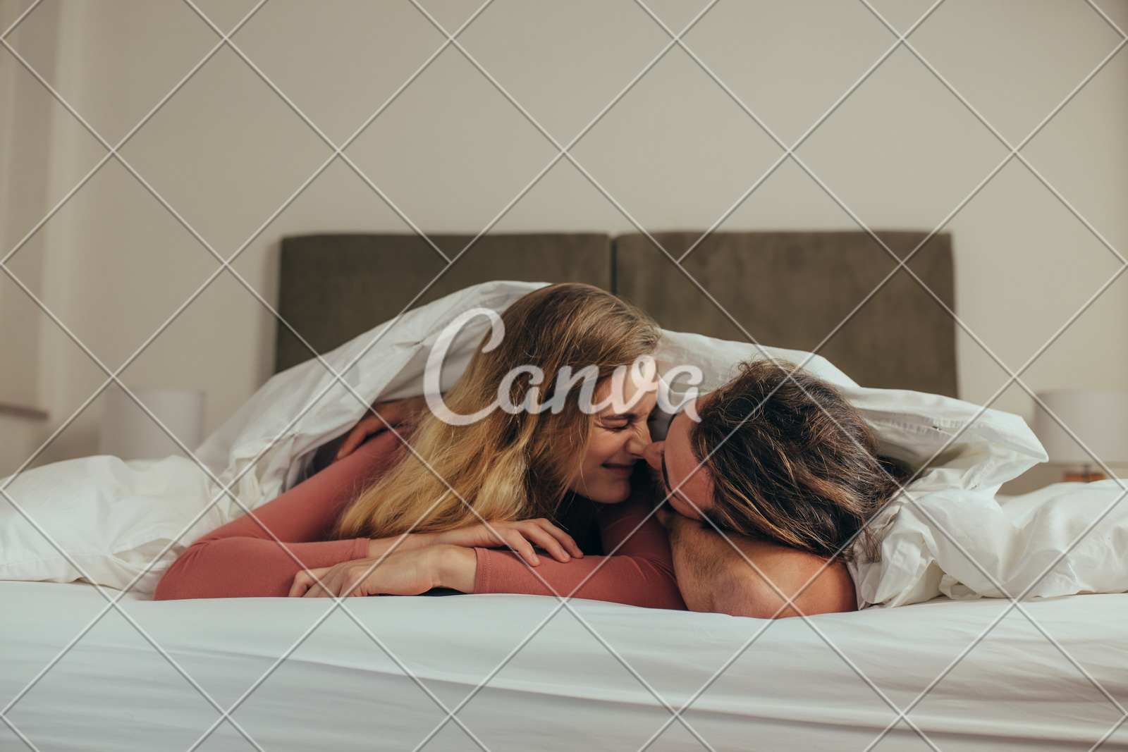 Romantic Couple Lying On Bed Together Photos By Canva
