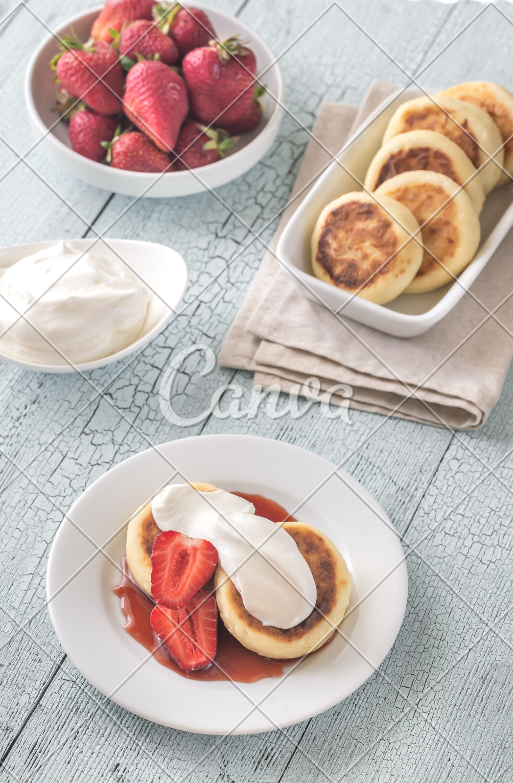 Cottage Cheese Patties With Whipped Cream And Berry Syrup Photos