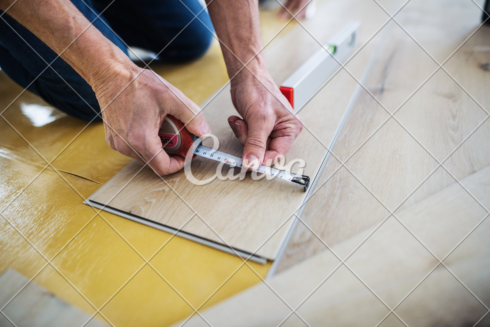 A Midsection Of Senior Man Laying Vinyl Flooring A New Home