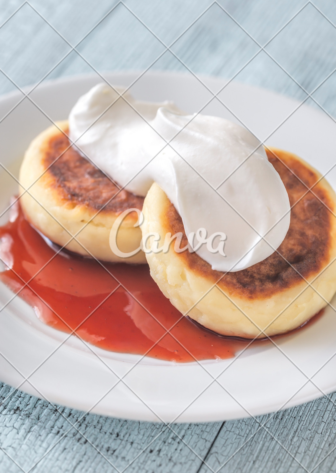 Cottage Cheese Patties With Whipped Cream And Berry Syrup Photos