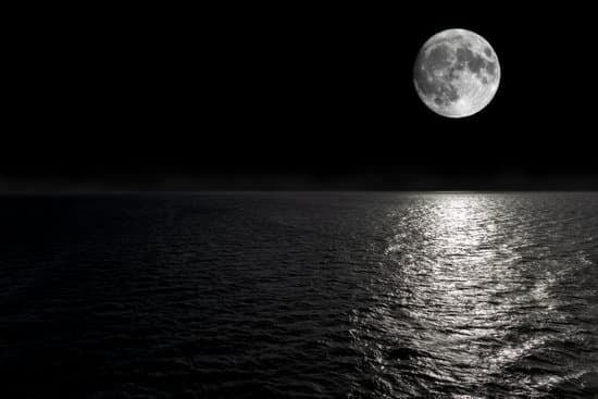 Full Moon Rising Over Empty Ocean At Night Photos By Canva