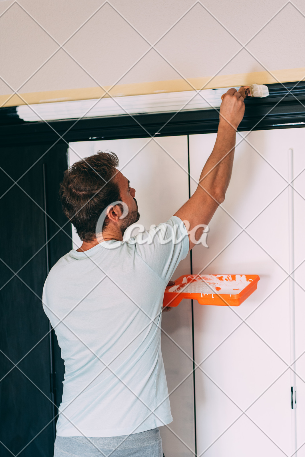 Man Painting A Wardrobe Photos By Canva