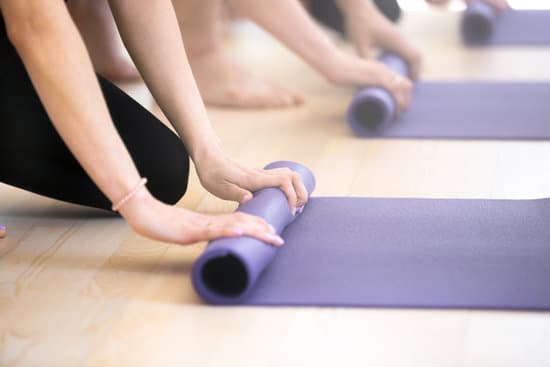 Close Up People Hands Folding Yoga Mats Photos By Canva