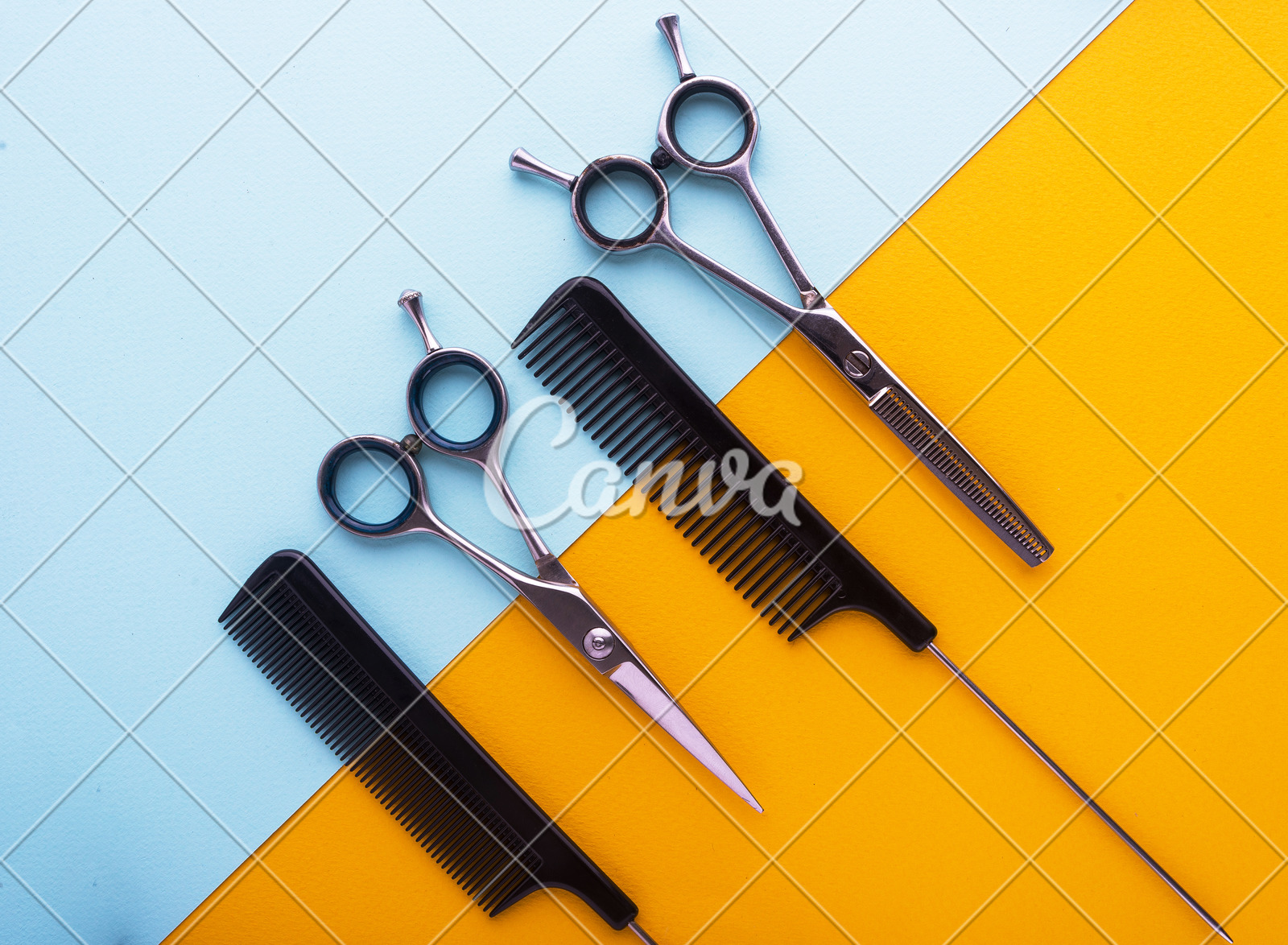 Combs And Hairdresser Tools On Color Cardboard Background Top View