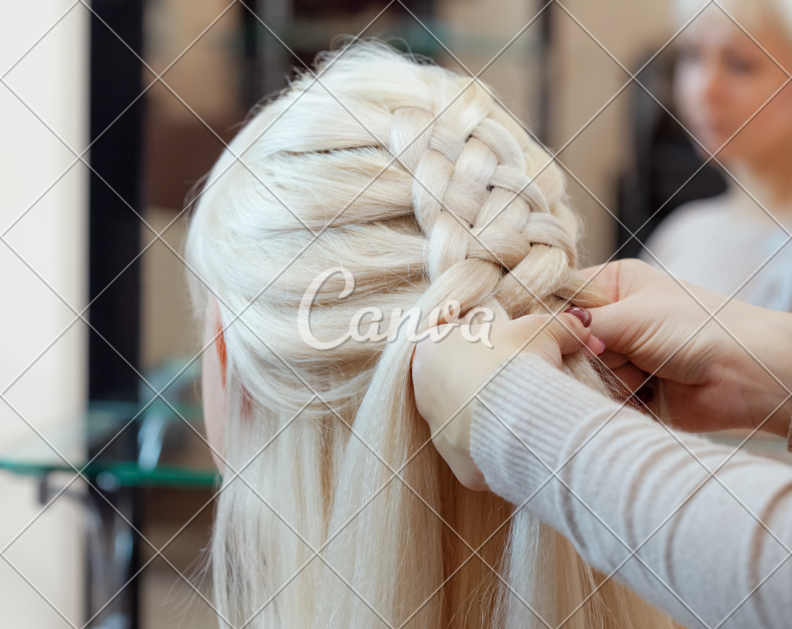 Beautiful Girl With Blonde Hair Hairdresser Weaves A Braid Close