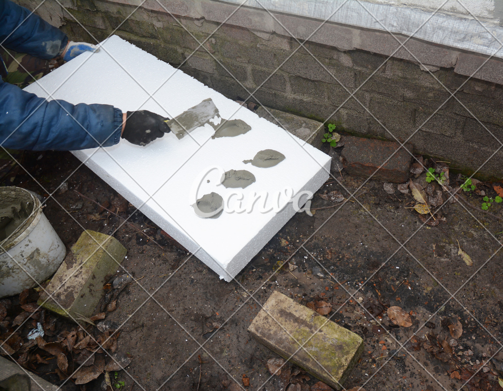 Contractor Insulating House Foundation With Styrofoam