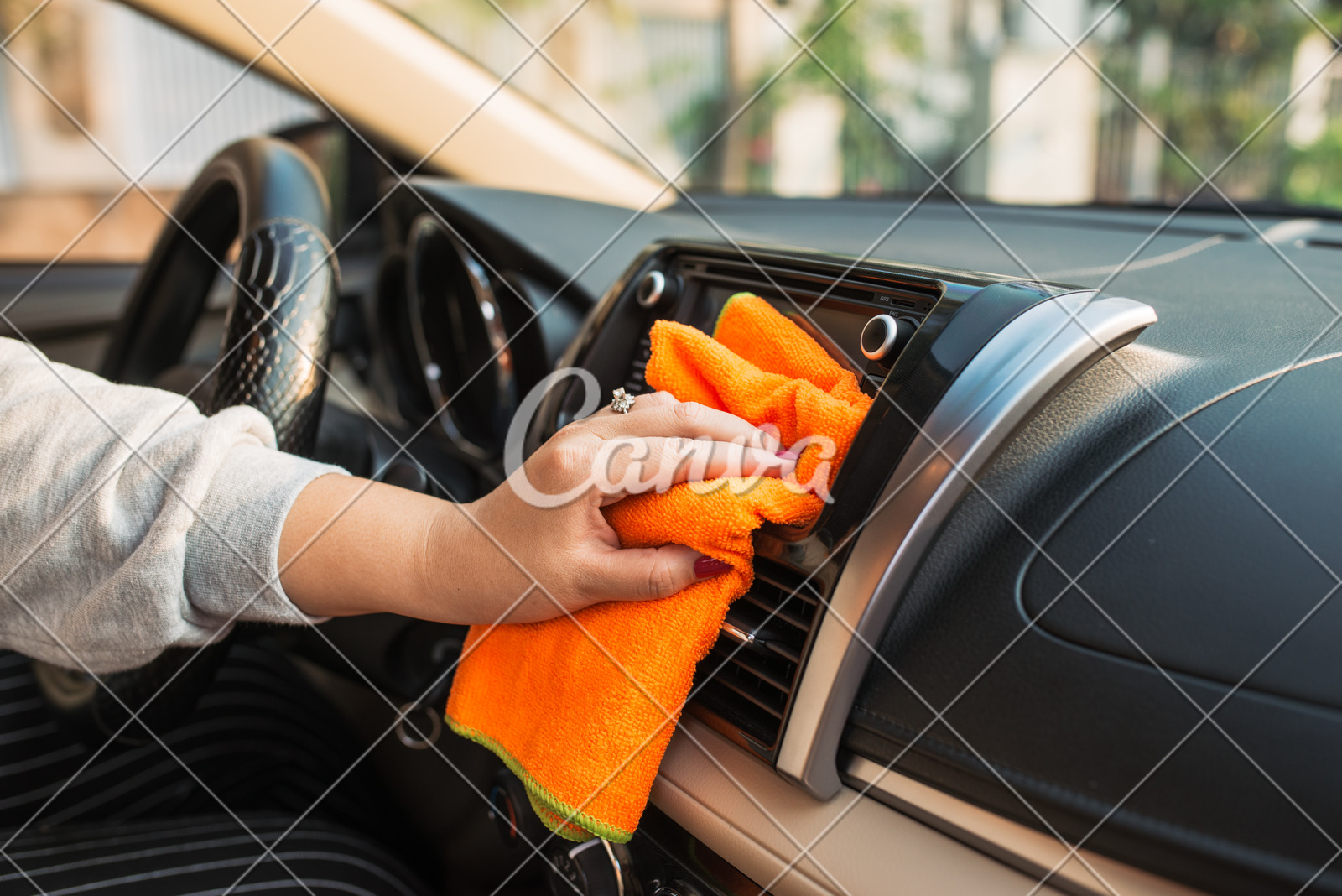 Hand With Microfiber Cloth Cleaning Seat Auto Detailing And
