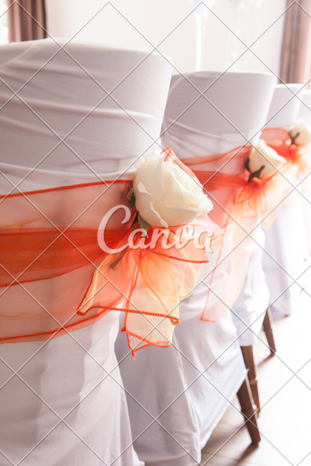 Wedding Chair Covers With Orange Sash Cream Flowers Photos By Canva