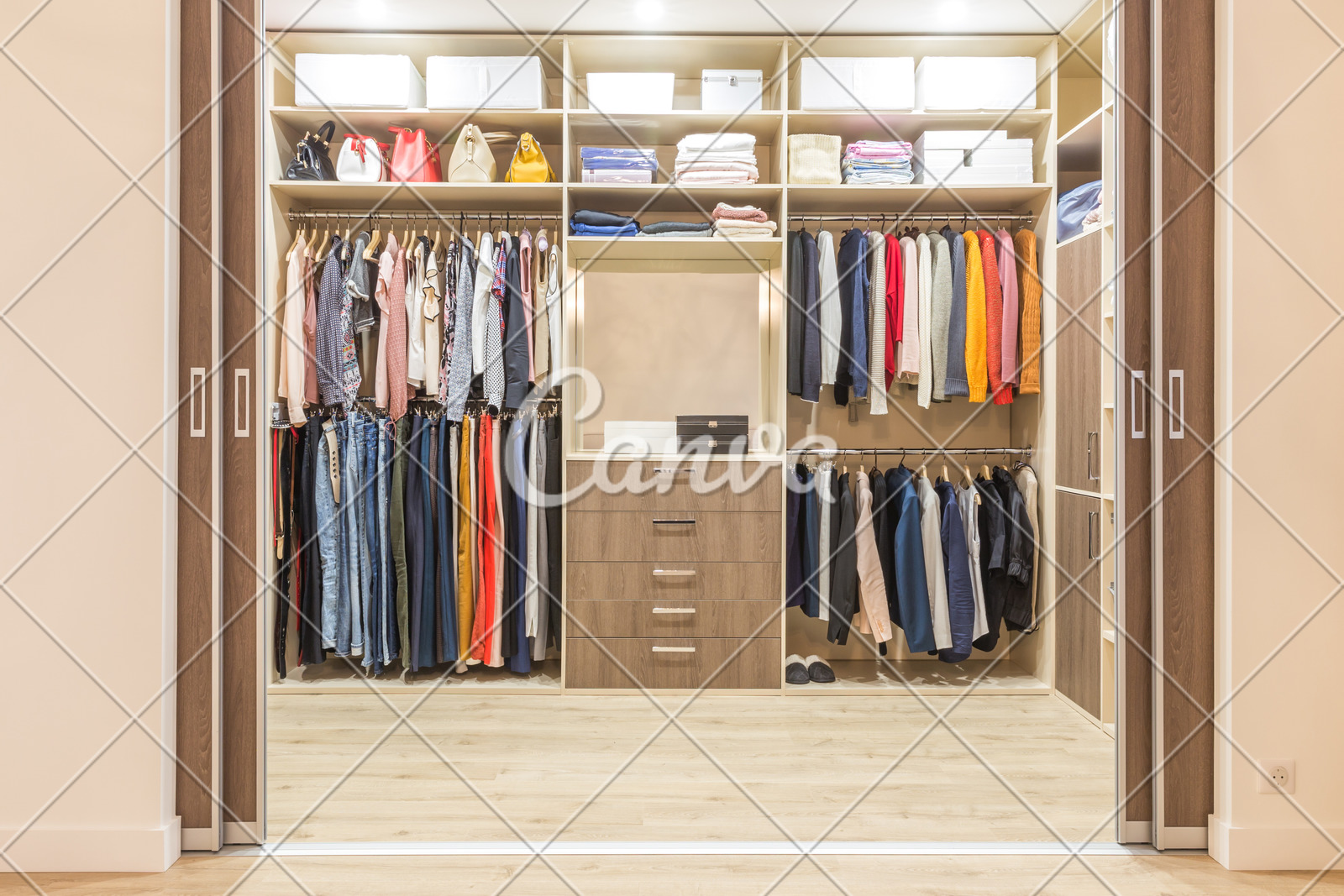 Modern Wooden Wardrobe With Clothes Hanging On Rail In Walk