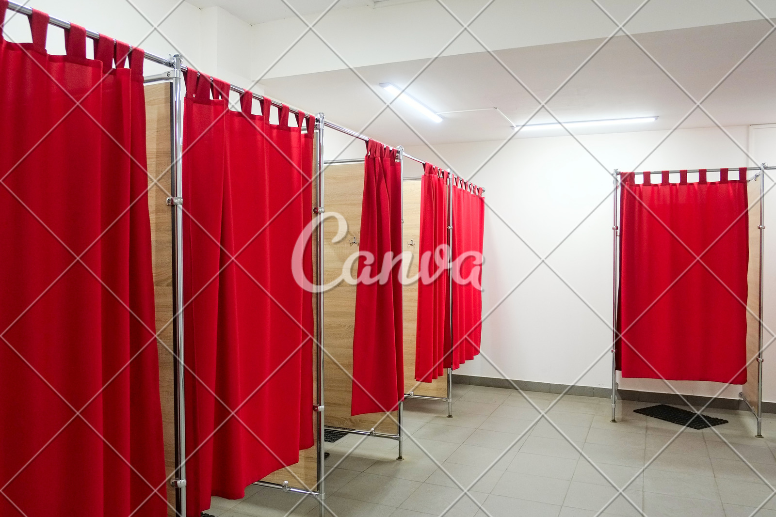 Empty Fitting Room With Red Curtains In Clothing Store