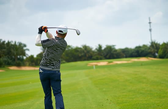 Man Swinging Golf Club In Sand Trap Photos By Canva