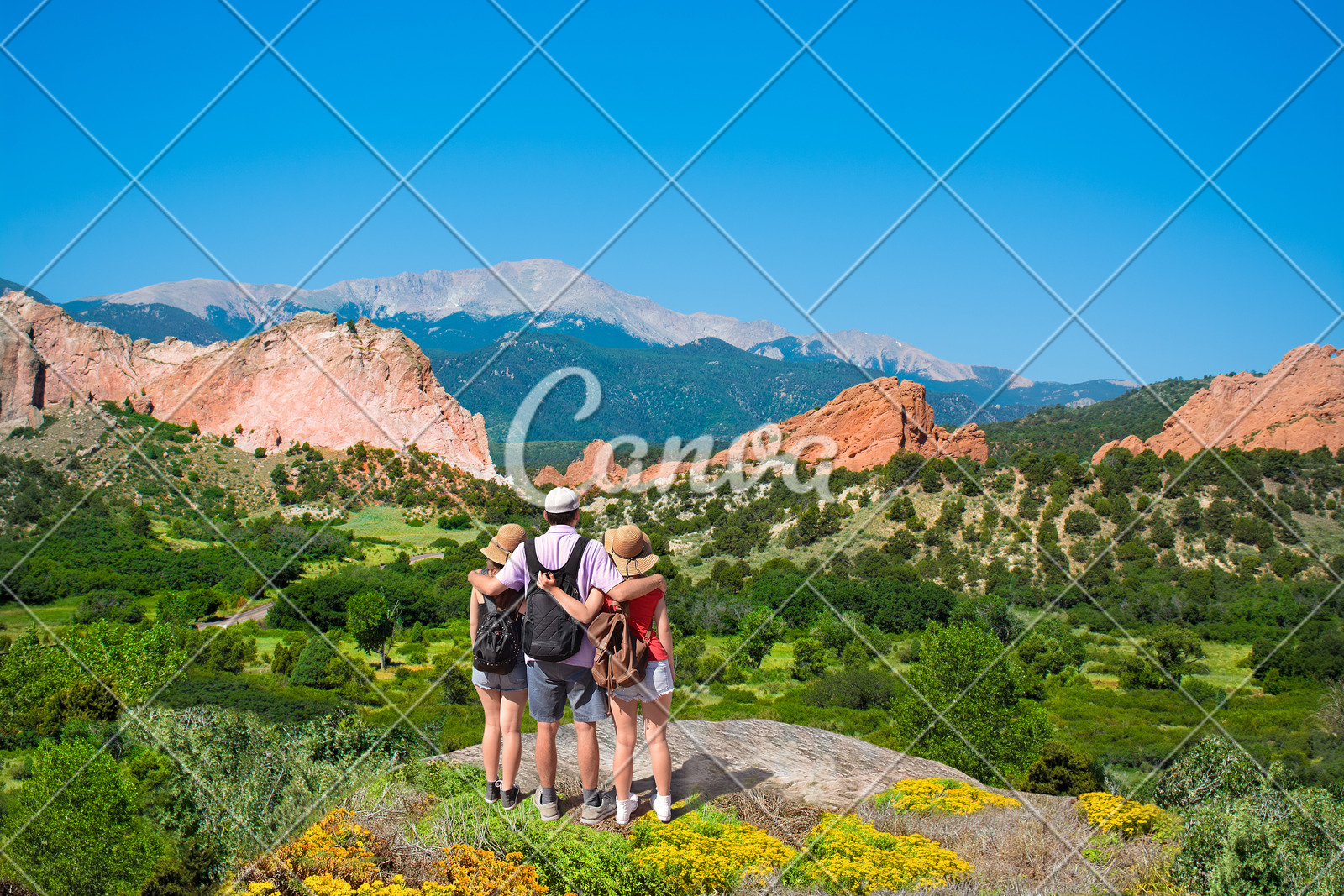 Happy Family Enjoying Beautiful Mountain View On Vacation Hiking