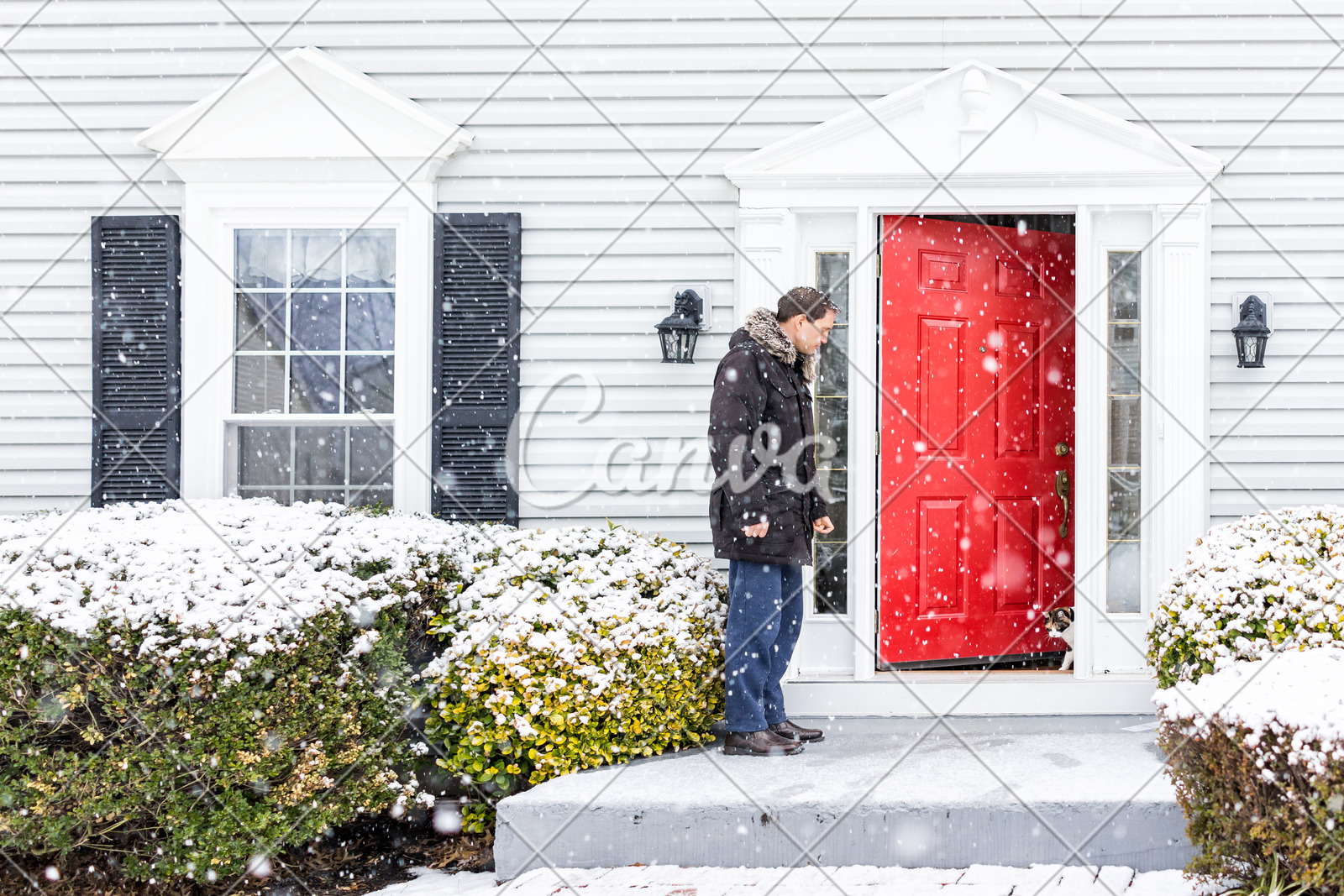 Young Man Outside Front Yard Red Door Of House With Snow