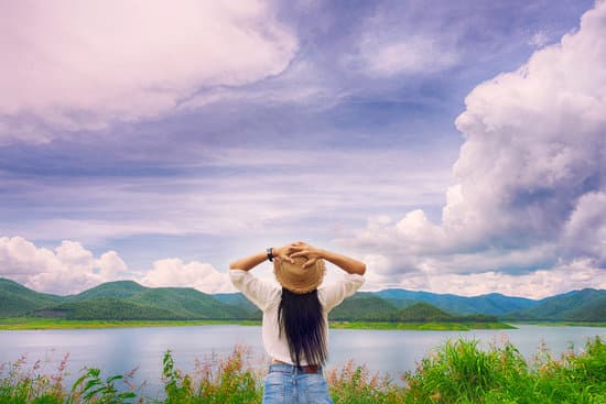 Happy woman standing in the valley