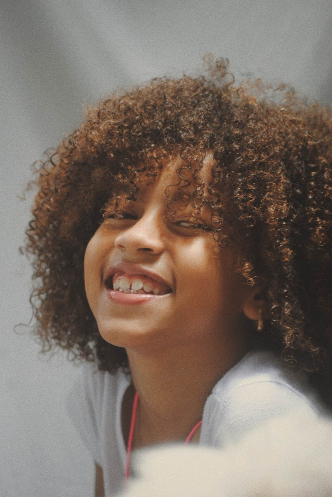 Close-Up Phot of Girl With Curly Hair - Photos by Canva