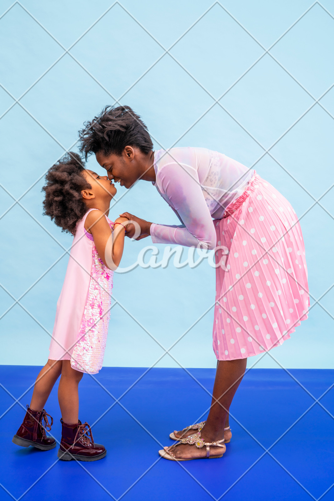 Mother Kissing Ethnic Daughter Holding Hands Photos By Canva 