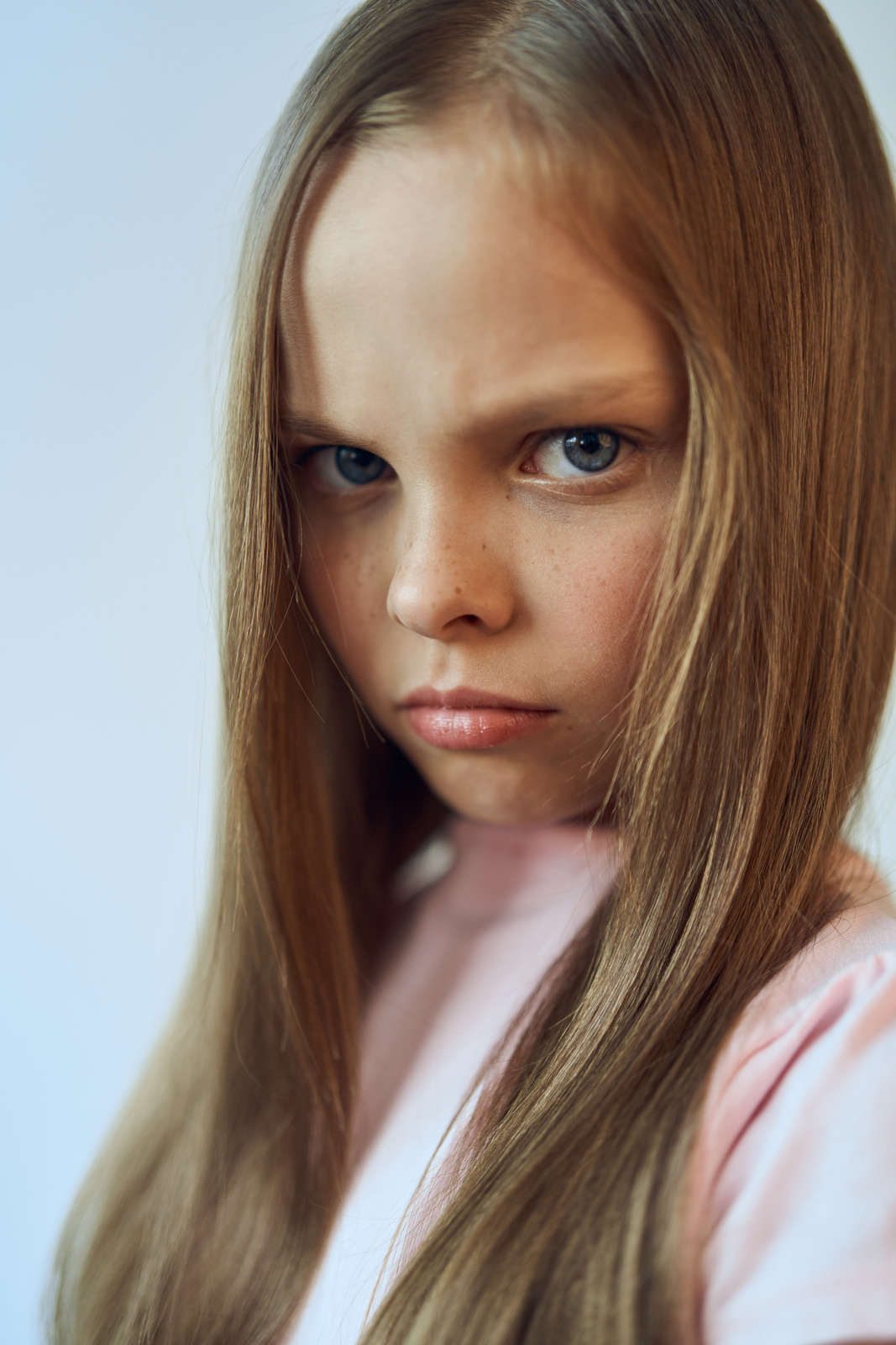 Girl With An Unhappy Expression On Her Face White T Shirt Resentment Emotions Photos By Canva