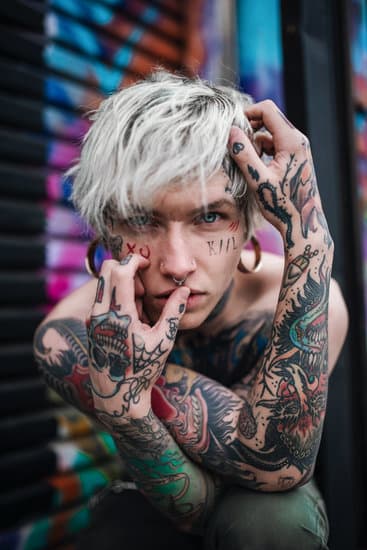 A Shirtless Man with Arm Tattoo - Photos by Canva