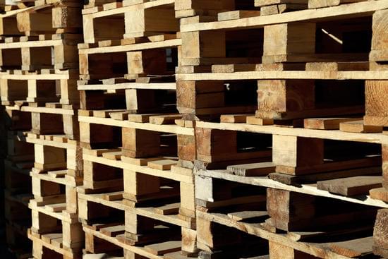 Many Empty Wooden Pallets Stacked as Background - Photos by Canva