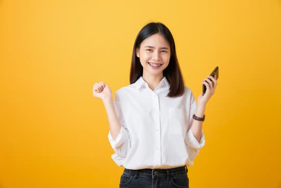 Happy Woman Holding a Smartphone