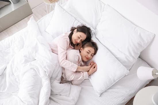 Lesbian Couple Sleeping In Bed Photos By Canva