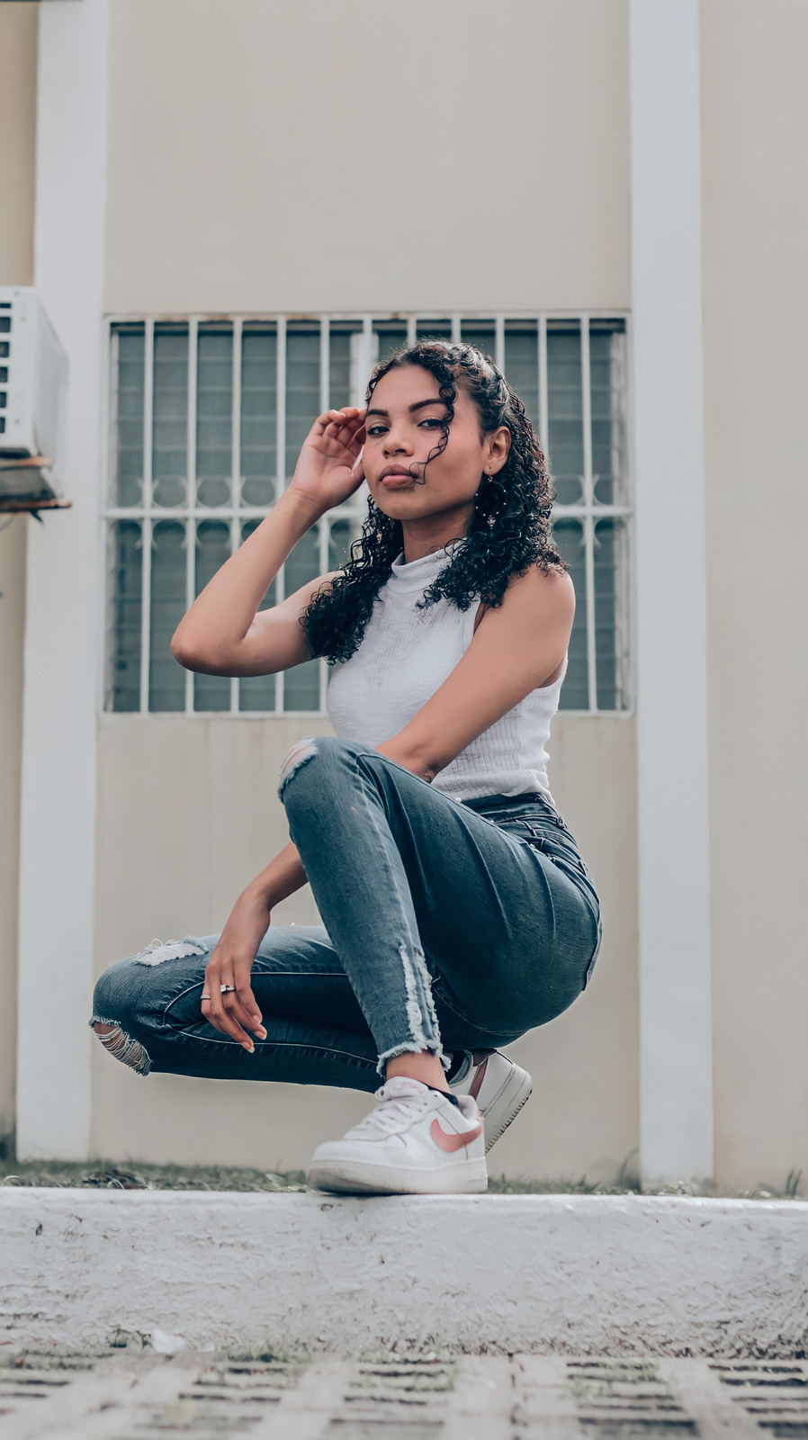 Woman Kneeling on Sidewalk - Photos by Canva