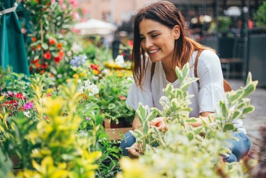 Happy woman buying flowers