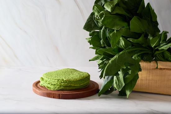 Green tortillas with spinach, round empty tortilla flatbread